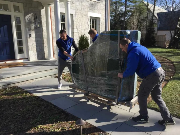 Cross country piano movers preparing a baby grand for long distance move from Aurora to California