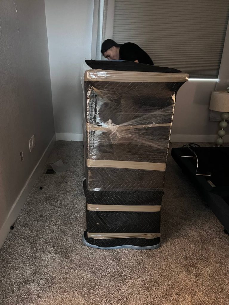 Efficient last minute movers near me packing boxes quickly for a same day move in Austin, Texas.