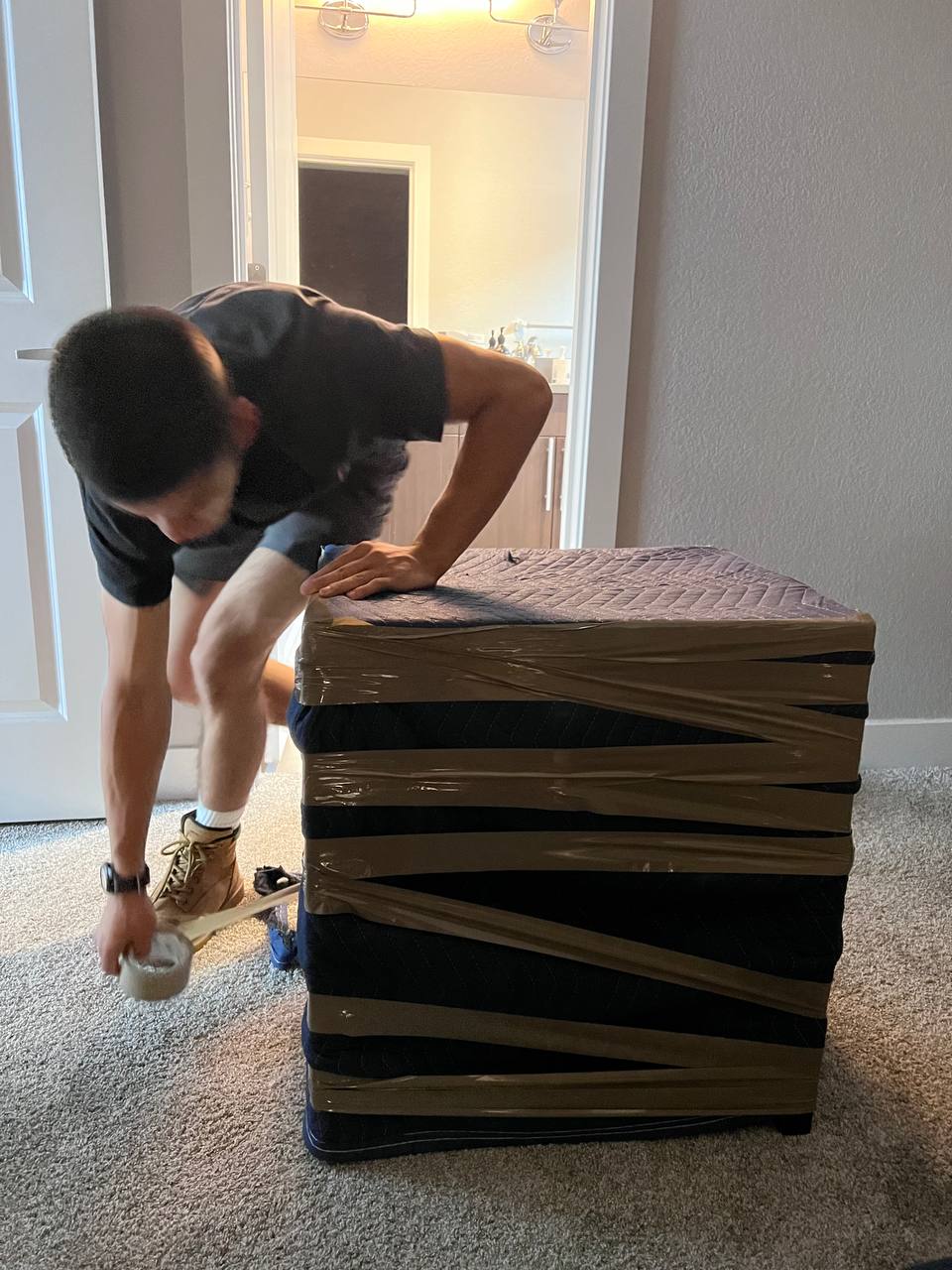 Professional local movers loading furniture into truck in Denver neighborhood