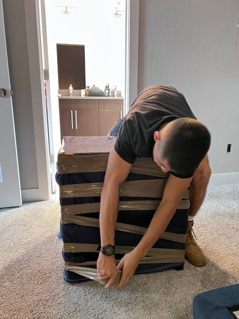 PackPalTeam white glove movers in Aurora carefully handling luxury furniture during relocation