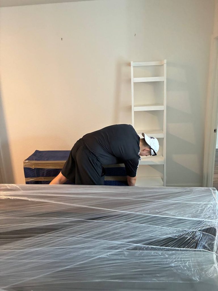 PackPalTeam installer assembling modern furniture in a Denver home